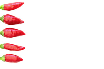 Red chilies displayed on white background with copy space