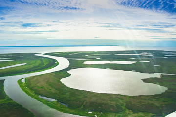 Evening sunset on the coast of the Arctic Ocean. Summer arctic landscape. The concept of climate...