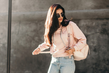 Beautiful model posing for the camera on the streets.