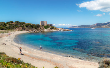 Fototapeta na wymiar Fortezza Vecchio beach with crystal clear blue water in Villasimius, Sardinia. Holidays, the best beaches in Sardinia.