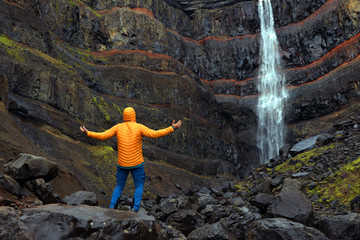 Hengifoss Canyon with the Hengifoss Waterfall, the third highest waterfall in Iceland is surrounded...