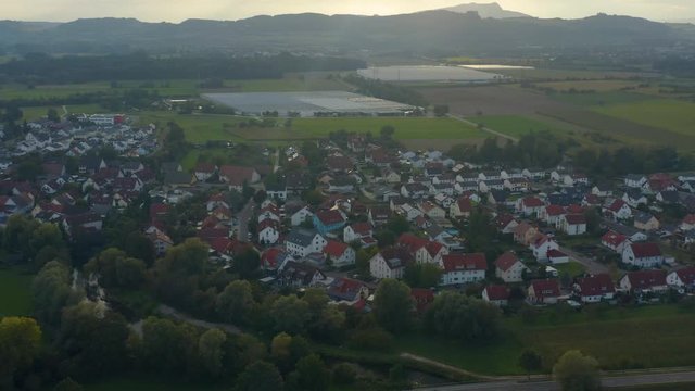 Aerial view of the city  Beuren an der Aach in Germany. On a sunny day in summer. Pan to the right around the village.