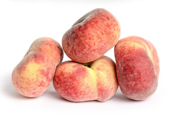 Selection of peaches shot on a white background