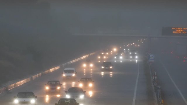 Traffic during a heavy rainy day Montpellier flooded highway lights on France