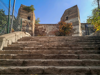 Stair close-up on the background of the fortress wall of Ankara Castle in Turkey. Entrance to the...