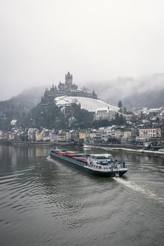 White and black ship on body of water