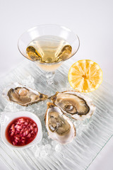 Opened Oysters with champagne and slices of lemon