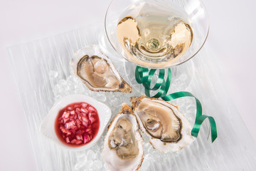 Opened Oysters with champagne and slices of lemon