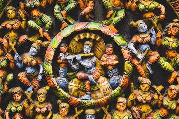 Yellow and black concrete statuette