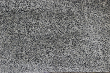 Texture of a granite wall with a small crack