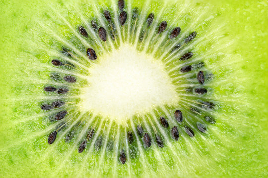 Close up, macro of the centre of a kiwi fruit showing seeds