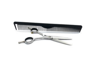 Professional scissors and comb isolated on white background. Real hairdressing tools. Set of scissors and combs for cutting hair