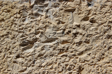 Wall hewn of natural rock