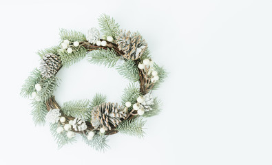 Fototapeta na wymiar Top view of Christmas round wreath made of natural with pinecones winter and Christmas concept.Flat lay background for text.