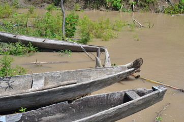 Typical wooden boats for transportation in the Amazon River Colombia