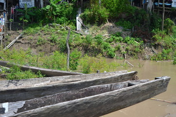 Typical wooden boats for transportation in the Amazon River Colombia