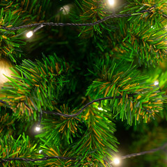 Merry Christmas and happy new year concept, Closeup of golden bauble hanging from a decorated tree with bokeh, Xmas holiday background.copy space.
