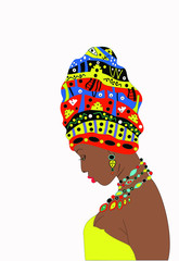 Girl  with dark skin with a turban on the head  (profile view).The girl tilted her head. Young girl pensive and modest 