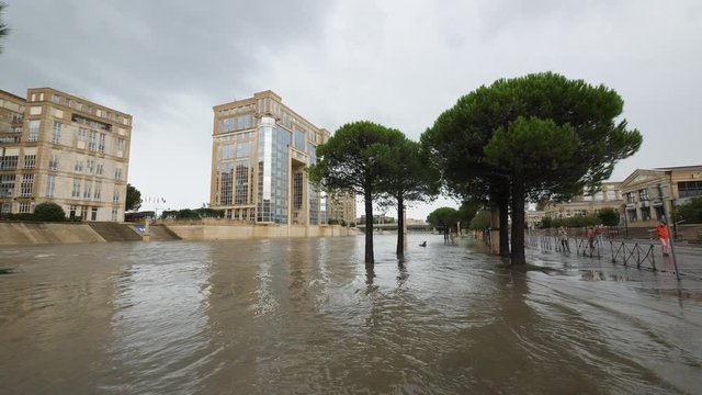 Montpellier le Lez flooded river cloudy day Antigone neighbourhood residential buildings