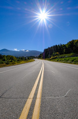 Fototapeta premium Empty highway seen in the wilderness of Vermont, United States.