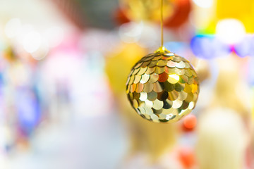 Christmas tree background with snow and bokeh background.Disco ball on Christmas tree decoration for celebration season.