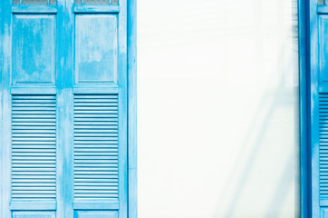 Close up Window and white wall in Oia town on Santorini island, Greece. Traditional and famous...