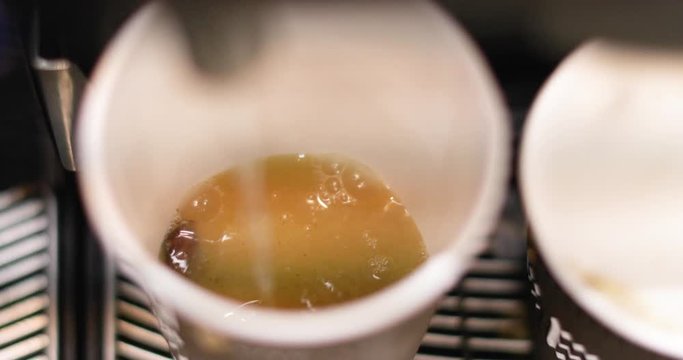 Preparing natural hot ginger tea using modern machine, closeup