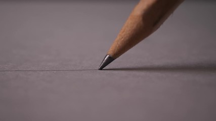 Hand drawing a flat line with a black pencil - Powered by Adobe
