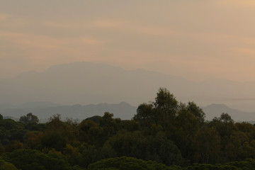Panoramic view of foggy mountains of Western Taurus and coniferous subtropical forest on the Mediterranean coast of Turkey at dawn