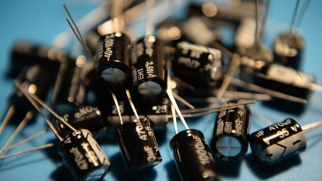 Close-up Electrolytic capacitors. Components of electronic devices, computers. Radio parts