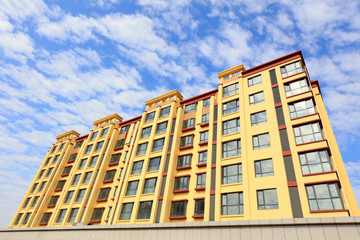 Fototapeta na wymiar residential building in the blue sky background