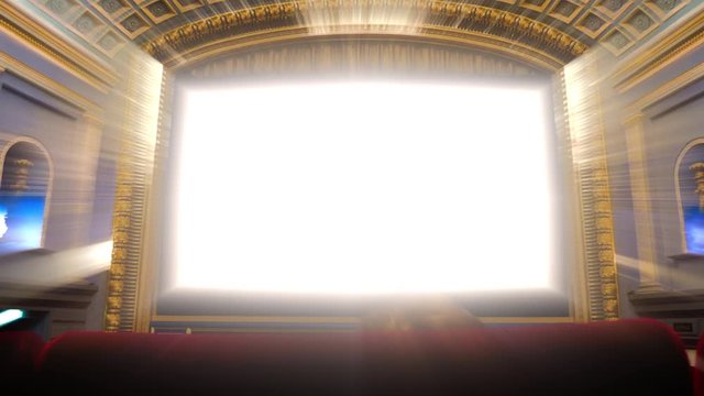 Large interior of vintage movie theater cinema with white iridescent beam of lights empty screen with large copy space waiting for the premiere of the latest blockbuster movie
