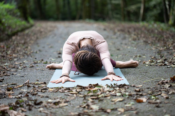 Woman Doing Yoga Exercises At The forest
