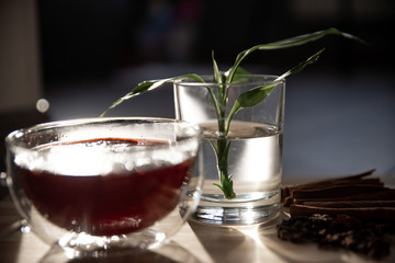mulled wine on a wooden tray with orange and spices. Mulled wine ingredients. Winter cocktail. drink in a double bottom cup.