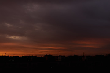 Beautiful autumn sunset from the window overlooking the city.