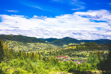 Fototapeta na wymiar Panoramic View of Carpathian Mountains in Summer Sunny Day. Mykulychyn, Ukraine