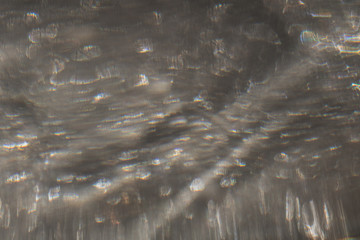 Blurred background withwater bubles in a glass. Abstract Christmas background.