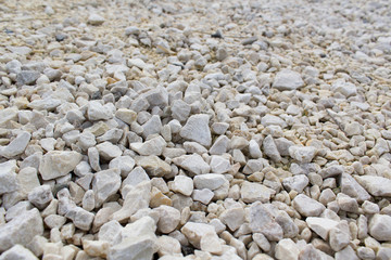 white smooth grey pebbles on beach natural stone background