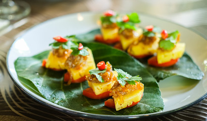 Ma Hor is name of thai traditional food. Fresh pineapple morsel topped with minced pork and peanuts