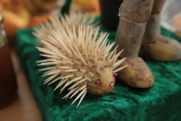 hedgehog of potatoes and toothpicks .hedgehog, handmade from the autumn theme for the kindergarten . The potatoes are stuffed with toothpaste and made of hedgehog.