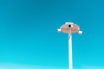 CCTV. Street surveillance cameras on a blue sky background. Copy space