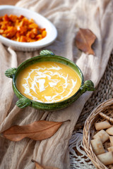 Pumpkin cream and roasted pumpkin dive in a nice bowl with some croutons. Close Up