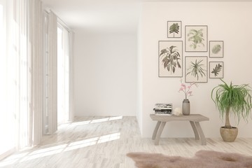 Empty room in white color with table and pictures on a wall. Scandinavian interior design. 3D illustration