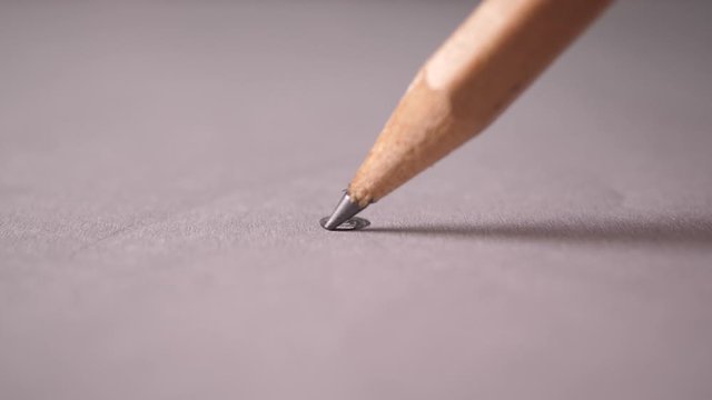 Hand drawing a flat line with a black pencil