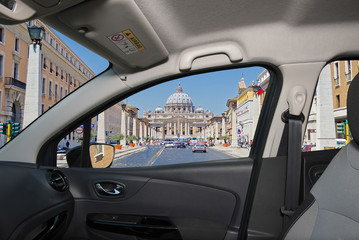 Car window with view of Saint Peter's Church, Rome, Italy