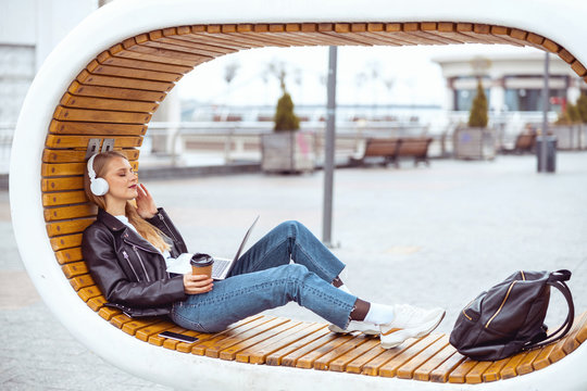 Young Beautiful Woman Listening To Soothing Music