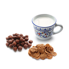 Healthy breakfast: cup of natural yogurt, whole grain cereal and corn balls with cocoa. Isolated on white background, side view.       