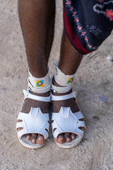 Tribal masai leg with a colorful bracelet, close up. Zanzibar, Tanzania, Africa