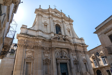 Fototapeta na wymiar LECCE, Puglia ,Italy - May 2, 2019: Facade of Ancient Baroque church Santa Irene in historical center in the old town. A region of Apulia. Ancient Baroque church, sant Irene facade, Lecce , Italy