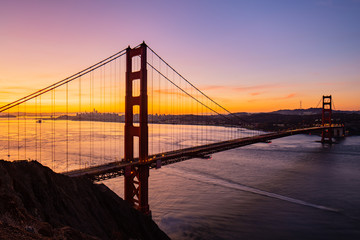 Purple Sunrise over Golden Gate Bridge and San Francisco California